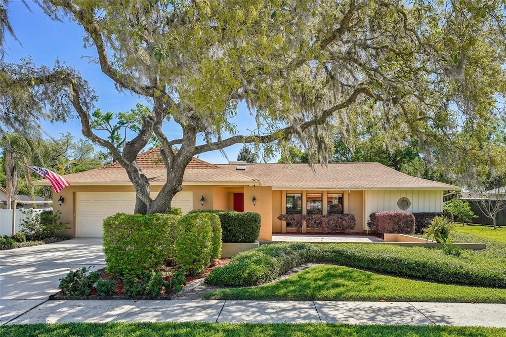2704 Herndon St, Valrico, FL 33596 - single story home featuring driveway, an attached garage, and stucco siding