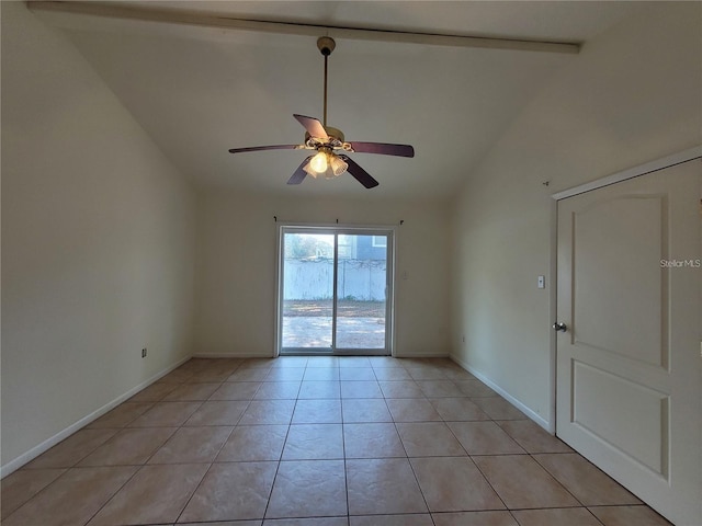 unfurnished room featuring light tile patterned floors, ceiling fan, vaulted ceiling, and baseboards