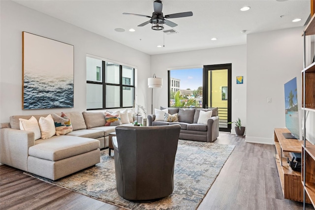 907 Arlington Ave N, Saint Petersburg, FL 33705 - living area featuring visible vents, baseboards, ceiling fan, wood finished floors, and recessed lighting