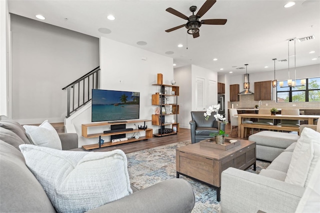 907 Arlington Ave N, Saint Petersburg, FL 33705 - living room with visible vents, light wood finished floors, recessed lighting, stairway, and a ceiling fan