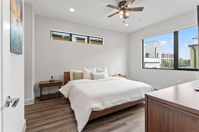 907 Arlington Ave N, Saint Petersburg, FL 33705 - bedroom with baseboards, recessed lighting, wood finished floors, and multiple windows