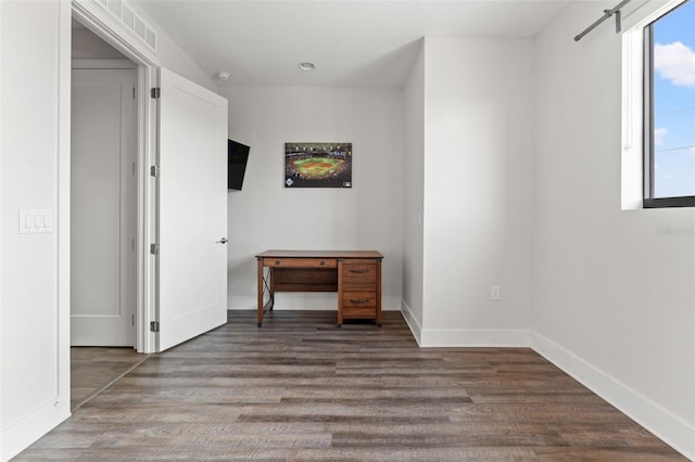 907 Arlington Ave N, Saint Petersburg, FL 33705 - empty room featuring visible vents, baseboards, and wood finished floors