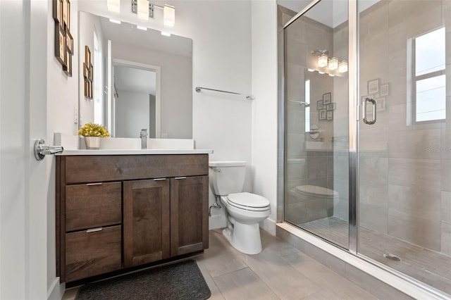 907 Arlington Ave N, Saint Petersburg, FL 33705 - bathroom featuring toilet, a stall shower, and vanity