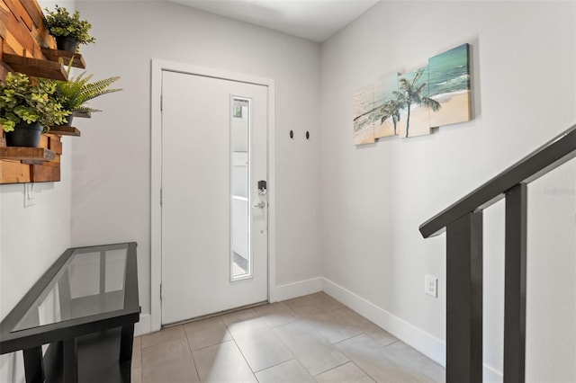 907 Arlington Ave N, Saint Petersburg, FL 33705 - foyer entrance featuring light tile patterned floors and baseboards