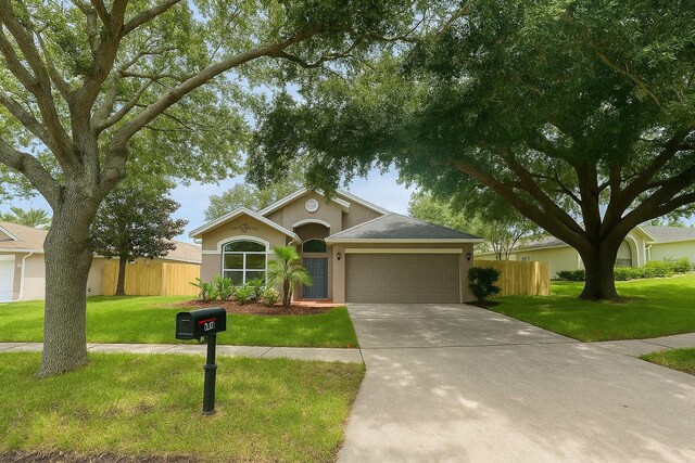 4731 Portobello Cir, Valrico, FL 33596 - single story home with an attached garage, stucco siding, and driveway