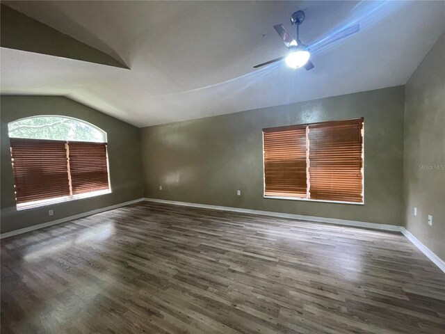 4731 Portobello Cir, Valrico, FL 33596 - unfurnished room with vaulted ceiling, wood finished floors, a ceiling fan, and baseboards