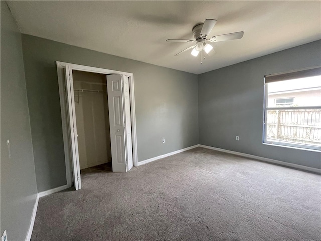 4731 Portobello Cir, Valrico, FL 33596 - unfurnished bedroom featuring carpet flooring, baseboards, a closet, and a ceiling fan