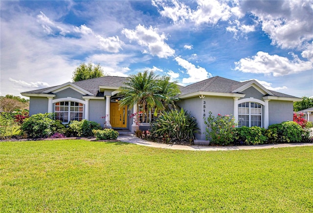 3518 Remington Oaks Way, Lakeland, FL 33810 - single story home featuring a front yard and stucco siding