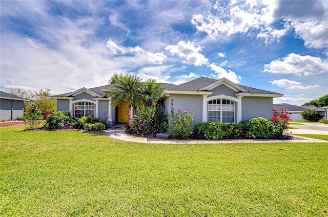 3518 Remington Oaks Way, Lakeland, FL 33810 - single story home with a front yard and stucco siding
