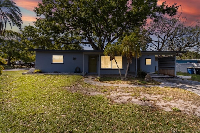 1411 Barry St, Clearwater, FL 33756 - view of front of home featuring an attached carport, driveway, and a front yard