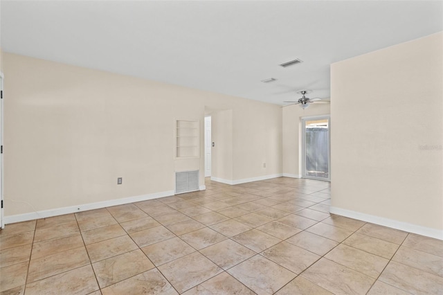 1411 Barry St, Clearwater, FL 33756 - spare room featuring baseboards, ceiling fan, visible vents, and light tile patterned floors