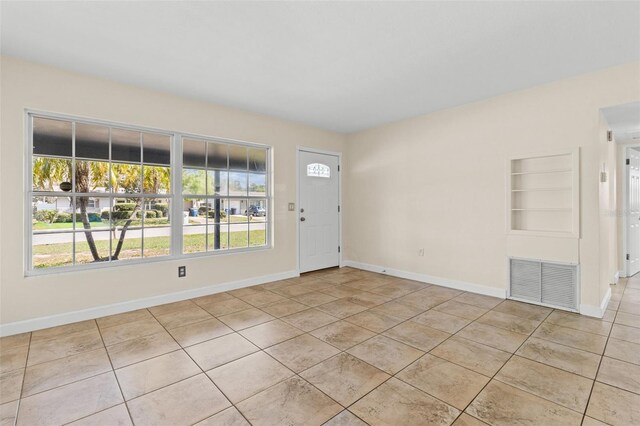 1411 Barry St, Clearwater, FL 33756 - tiled foyer with a wealth of natural light, baseboards, and visible vents