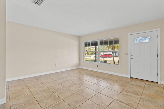 1411 Barry St, Clearwater, FL 33756 - foyer entrance with baseboards, visible vents, and light tile patterned floors