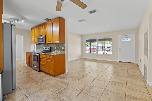1411 Barry St, Clearwater, FL 33756 - kitchen with visible vents, a ceiling fan, backsplash, and stainless steel appliances