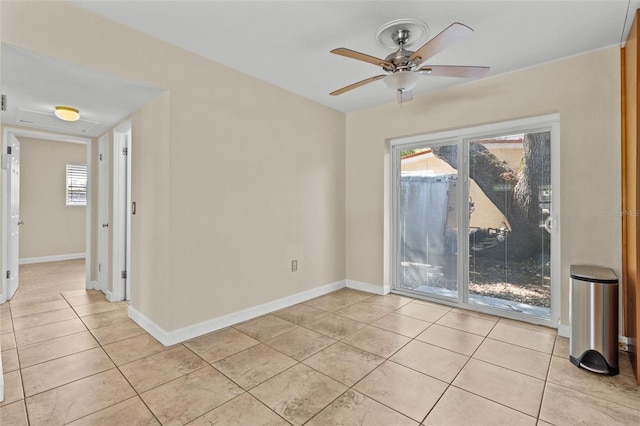 1411 Barry St, Clearwater, FL 33756 - empty room featuring baseboards, ceiling fan, and light tile patterned floors