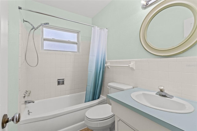1411 Barry St, Clearwater, FL 33756 - bathroom with shower / bathtub combination with curtain, vanity, tile walls, toilet, and a wainscoted wall