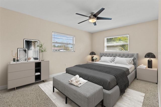1411 Barry St, Clearwater, FL 33756 - bedroom with light speckled floor, baseboards, and multiple windows