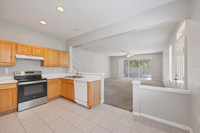 kitchen featuring white dishwasher, electric range, under cabinet range hood, a peninsula, and open floor plan