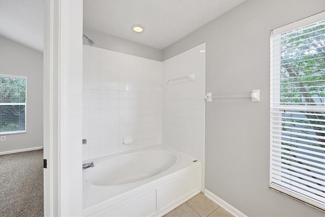 full bathroom featuring baseboards, bathing tub / shower combination, and tile patterned flooring