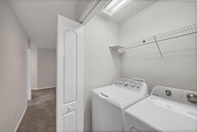 laundry room featuring independent washer and dryer, carpet floors, and baseboards