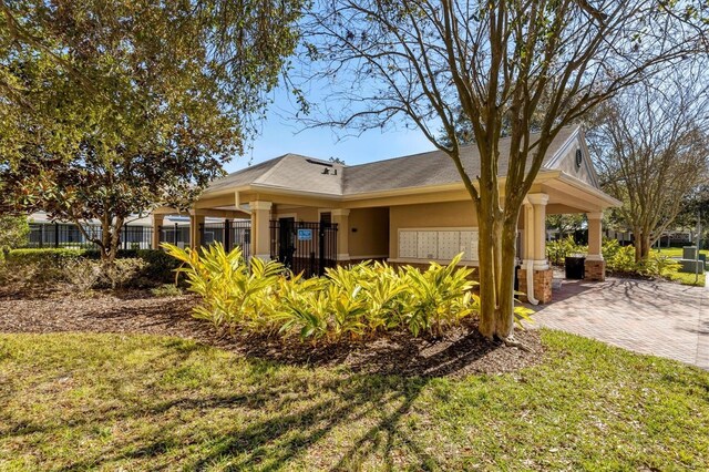 view of front of property with fence and stucco siding