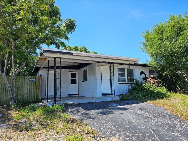 view of front of house featuring fence