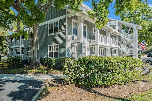 view of side of property featuring central AC unit