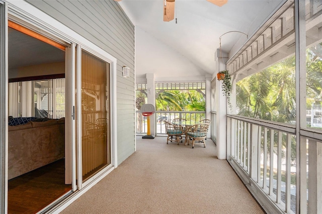 sunroom featuring ceiling fan