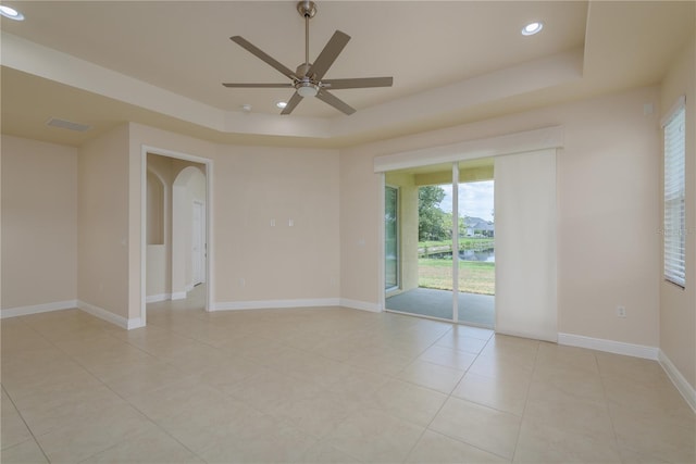 19123 Sunset Bay Dr, Land O Lakes, FL 34638 - unfurnished room with recessed lighting, a raised ceiling, ceiling fan, and light tile patterned floors