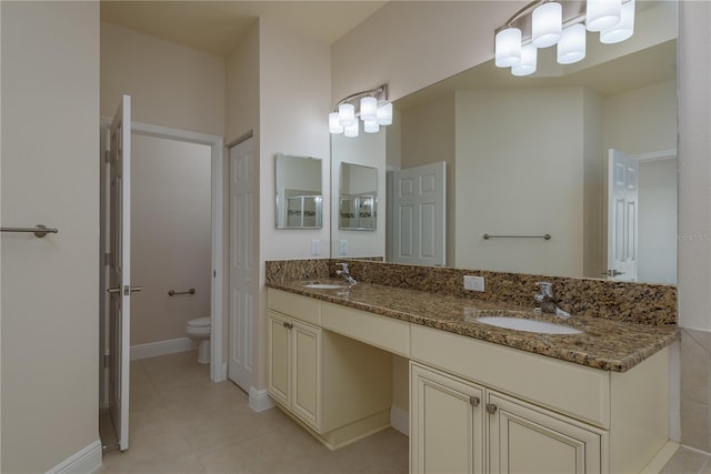 19123 Sunset Bay Dr, Land O Lakes, FL 34638 - bathroom featuring double vanity, toilet, tile patterned floors, and a sink