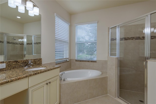 19123 Sunset Bay Dr, Land O Lakes, FL 34638 - bathroom featuring a shower stall, a garden tub, and vanity