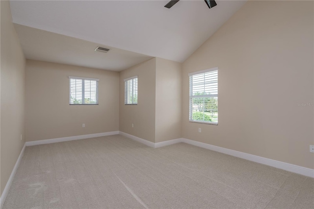 19123 Sunset Bay Dr, Land O Lakes, FL 34638 - unfurnished room with ceiling fan, visible vents, vaulted ceiling, baseboards, and light carpet