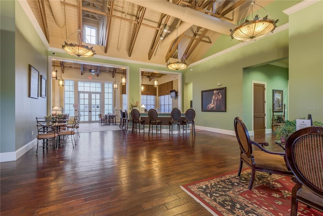 19123 Sunset Bay Dr, Land O Lakes, FL 34638 - dining space featuring high vaulted ceiling, baseboards, and hardwood / wood-style flooring