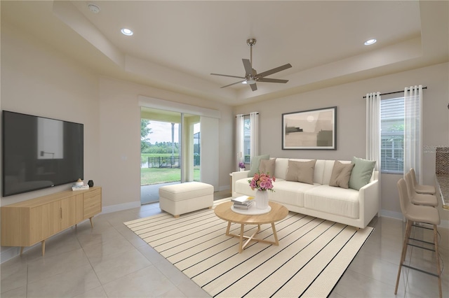 19123 Sunset Bay Dr, Land O Lakes, FL 34638 - living room with baseboards, recessed lighting, a raised ceiling, a ceiling fan, and light tile patterned floors