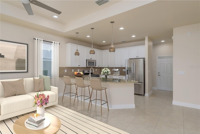 19123 Sunset Bay Dr, Land O Lakes, FL 34638 - living room with light tile patterned floors, a ceiling fan, visible vents, baseboards, and recessed lighting