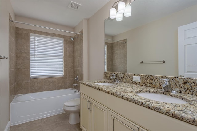 19123 Sunset Bay Dr, Land O Lakes, FL 34638 - full bathroom featuring tile patterned floors, toilet, visible vents, and a sink