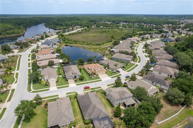 19123 Sunset Bay Dr, Land O Lakes, FL 34638 - birds eye view of property featuring a wooded view, a water view, and a residential view