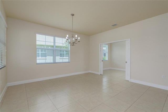 19123 Sunset Bay Dr, Land O Lakes, FL 34638 - unfurnished room featuring baseboards, an inviting chandelier, light tile patterned floors, and visible vents