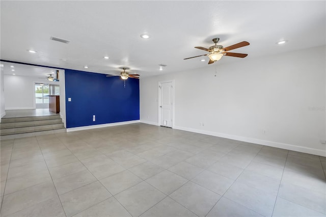 spare room featuring recessed lighting, baseboards, and ceiling fan