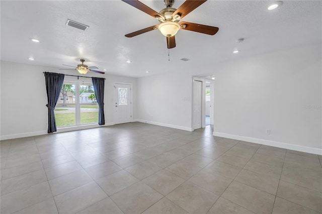 empty room featuring baseboards, ceiling fan, visible vents, and recessed lighting