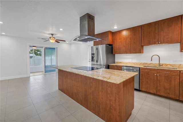 kitchen with ceiling fan, appliances with stainless steel finishes, a sink, island range hood, and a center island