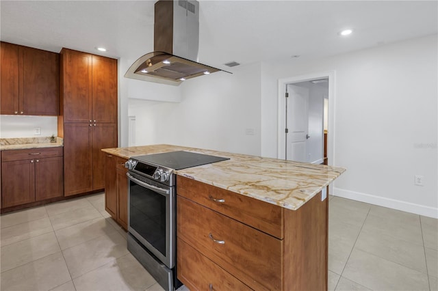 kitchen with island exhaust hood, stainless steel range with electric cooktop, recessed lighting, and light tile patterned floors