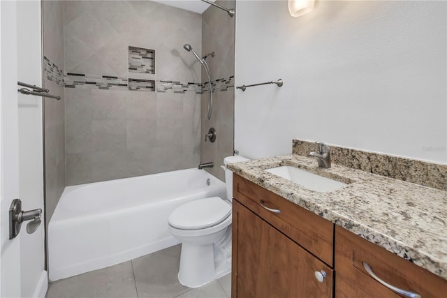 bathroom featuring toilet, vanity, shower / tub combination, and tile patterned flooring