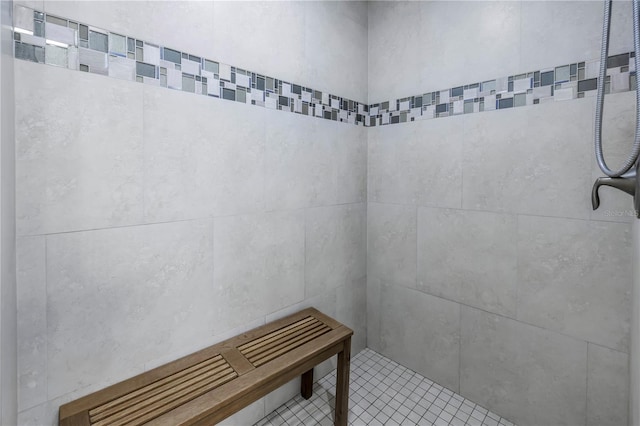 bathroom with tiled shower
