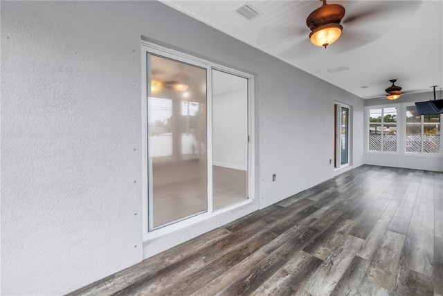 unfurnished sunroom with visible vents