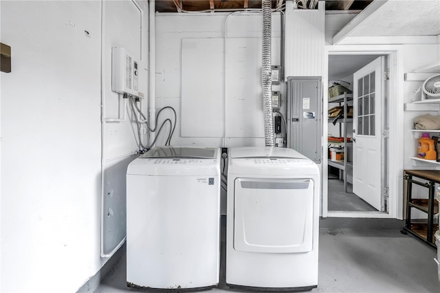 laundry room featuring washing machine and dryer and laundry area