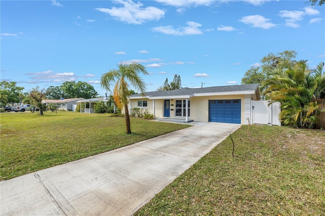 ranch-style house featuring concrete driveway, stucco siding, a front yard, a gate, and a garage