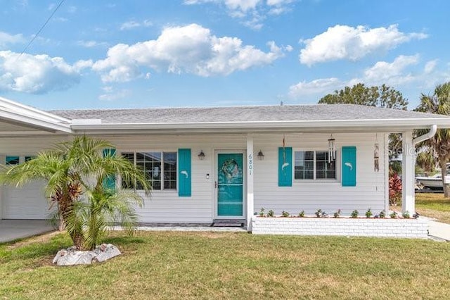 ranch-style house with covered porch and a front lawn