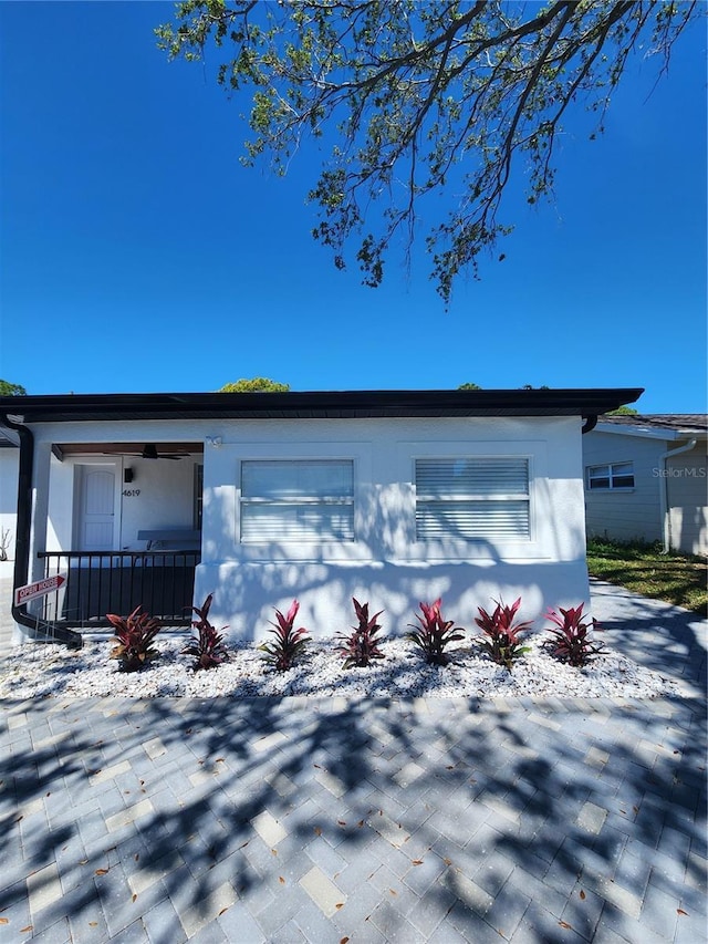 4619 Helena St NE, Saint Petersburg, FL 33703 - exterior space featuring covered porch and stucco siding