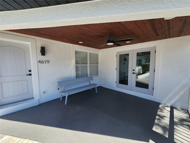 4619 Helena St NE, Saint Petersburg, FL 33703 - view of exterior entry featuring stucco siding, french doors, and a ceiling fan